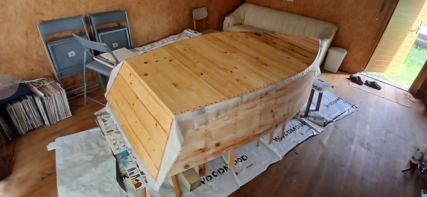 Fiberglassing the bottom of the hull and transom done