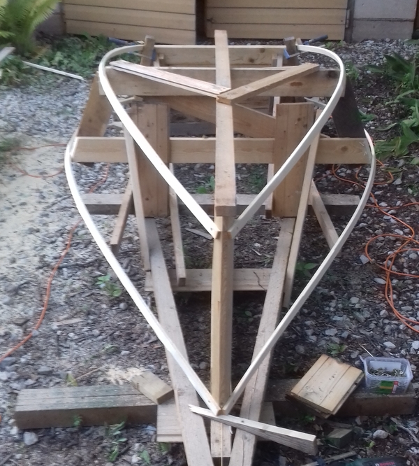 Planning for planking with battens to mark the sheer (here in the bottom as the boat is upside down) and chine lines. Take 1.